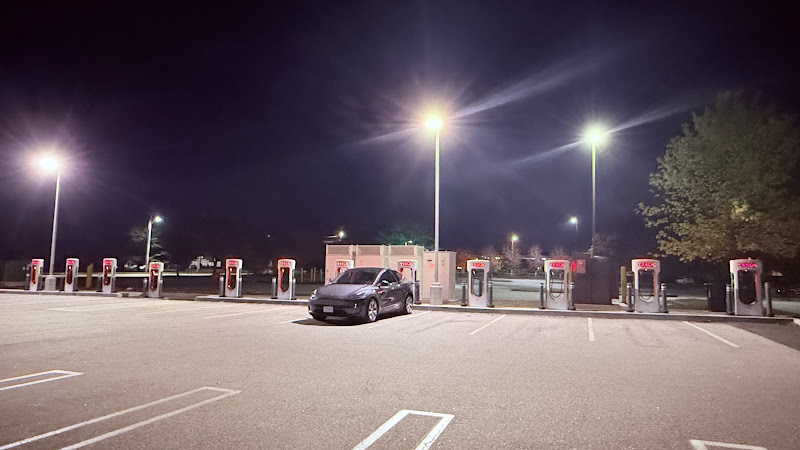 Tesla Supercharger EV Charging Station at Parking lot