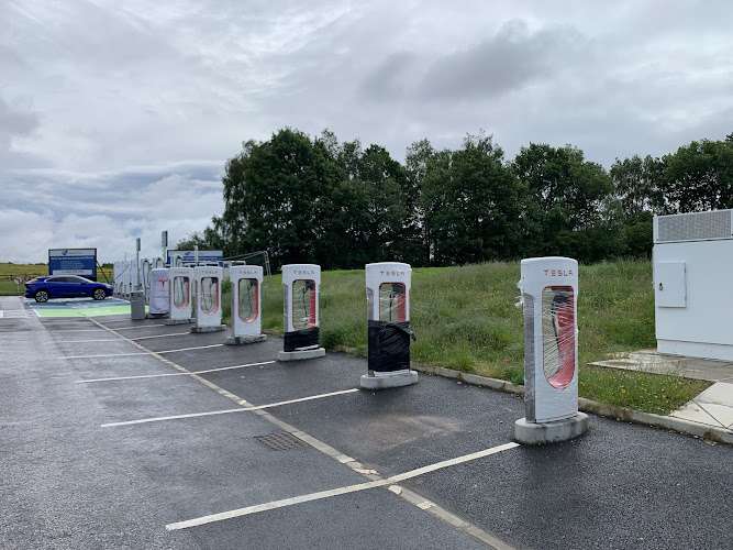 Tesla Supercharger EV Charging Station at Moto Birch Eastbound