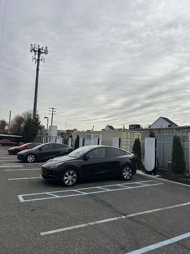 Tesla Supercharger EV Charging Station at 1300 Peninsula Blvd