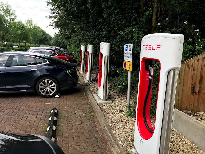 Tesla Supercharger EV Charging Station at 12/13 M40