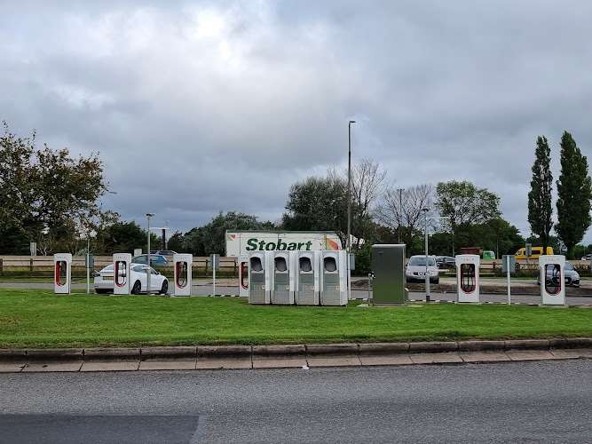 Tesla Supercharger EV Charging Station at 30/31 M1