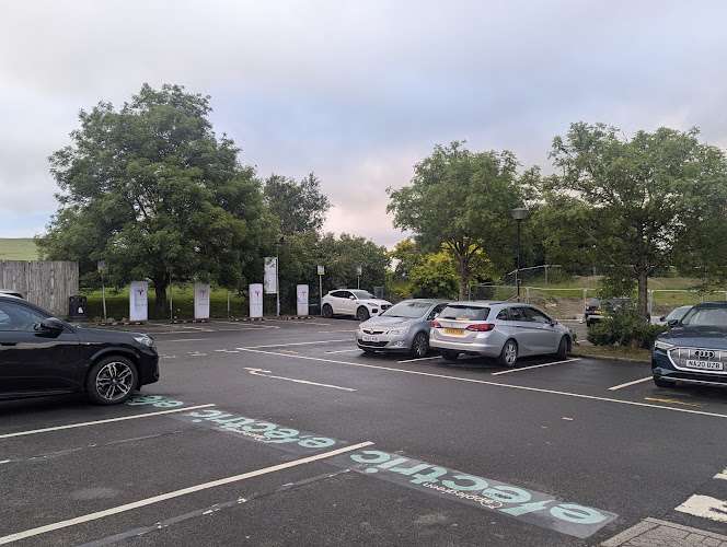 Tesla Supercharger EV Charging Station at M74 Junction 13