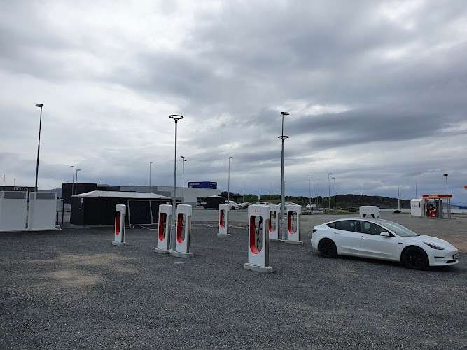 Tesla Supercharger EV Charging Station at Hamneveien / Kalvøyveien