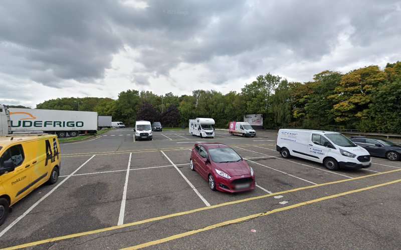 Tesla Supercharger EV Charging Station at Junction 4 and 5